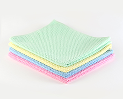 Pile of Waffle Floor Cloths in pink, blue, yellow and green